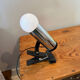 Clamp lamp/spotlight design made in Italy in chrome and black plastic.