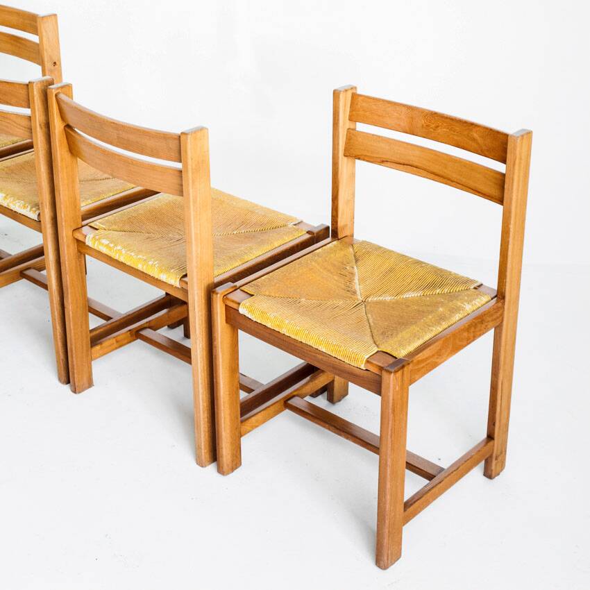Extendable table and 4 chairs set with a rationalist design in solid elm wood. France, 70's