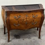 Curved and inlaid Louis XV style chest of drawers
