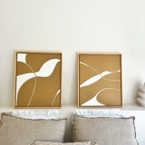 Diptych relief panels with a brown camel and cream background.