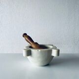 Old marble mortar with wooden pestle