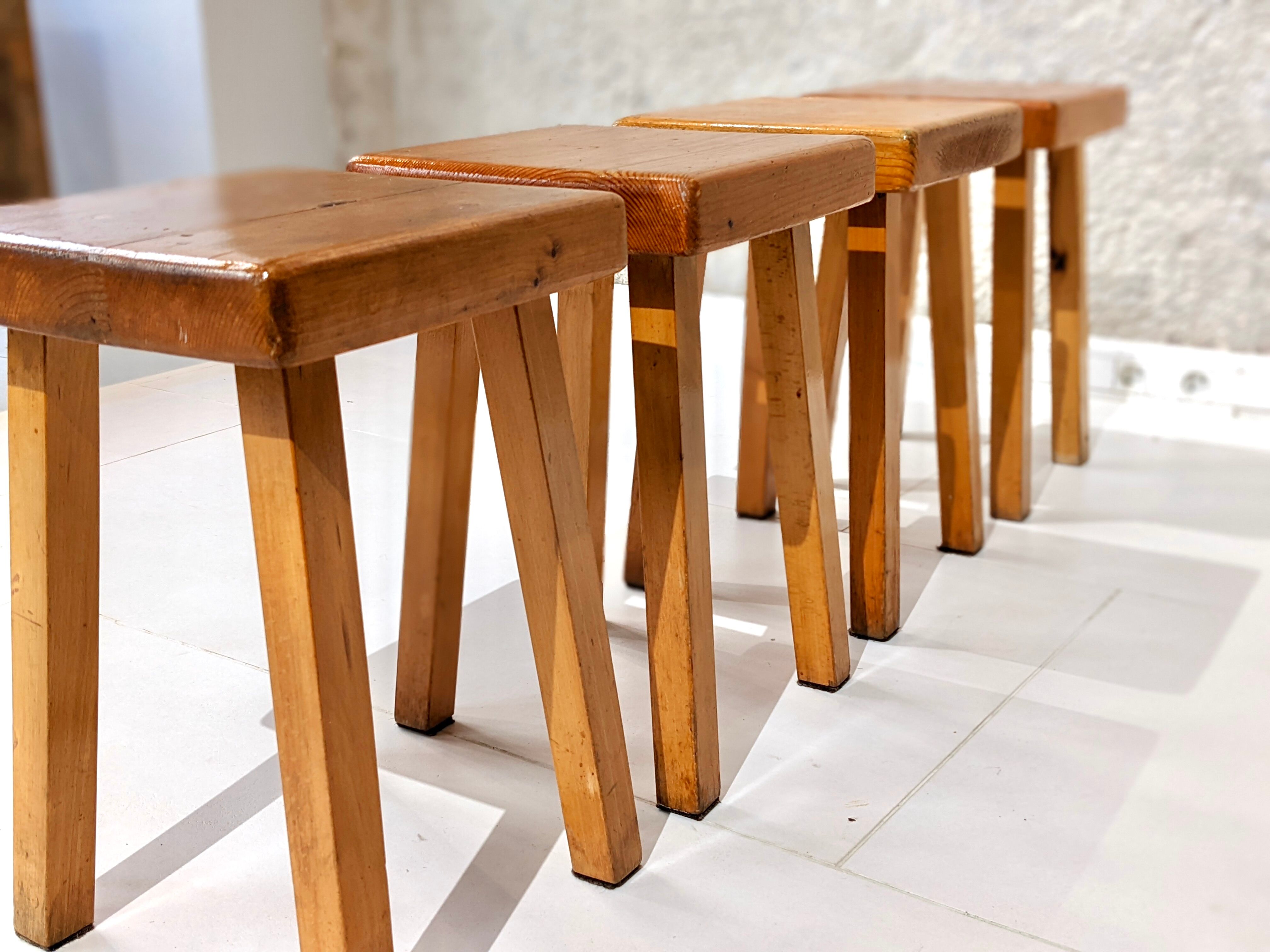Set of 4 pine wood stools by Charlotte Perriand for Les Arcs 1800