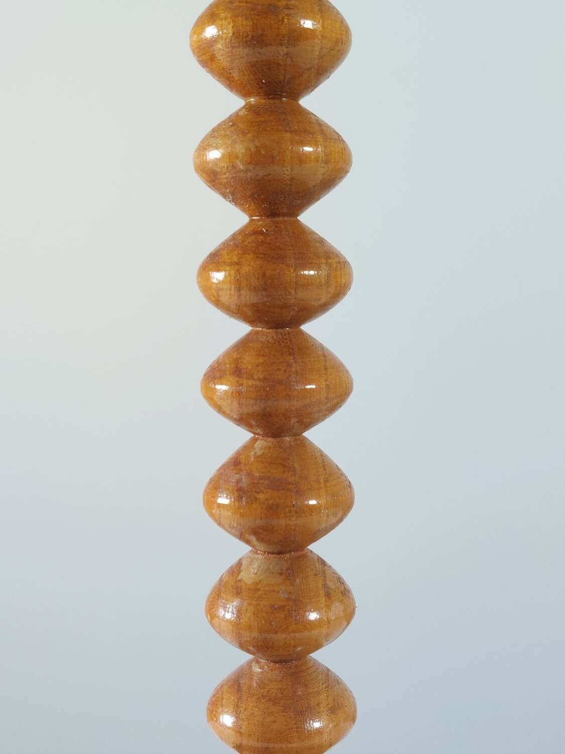Vintage mid-century wooden candlestick, spool decoration from the 1970s.