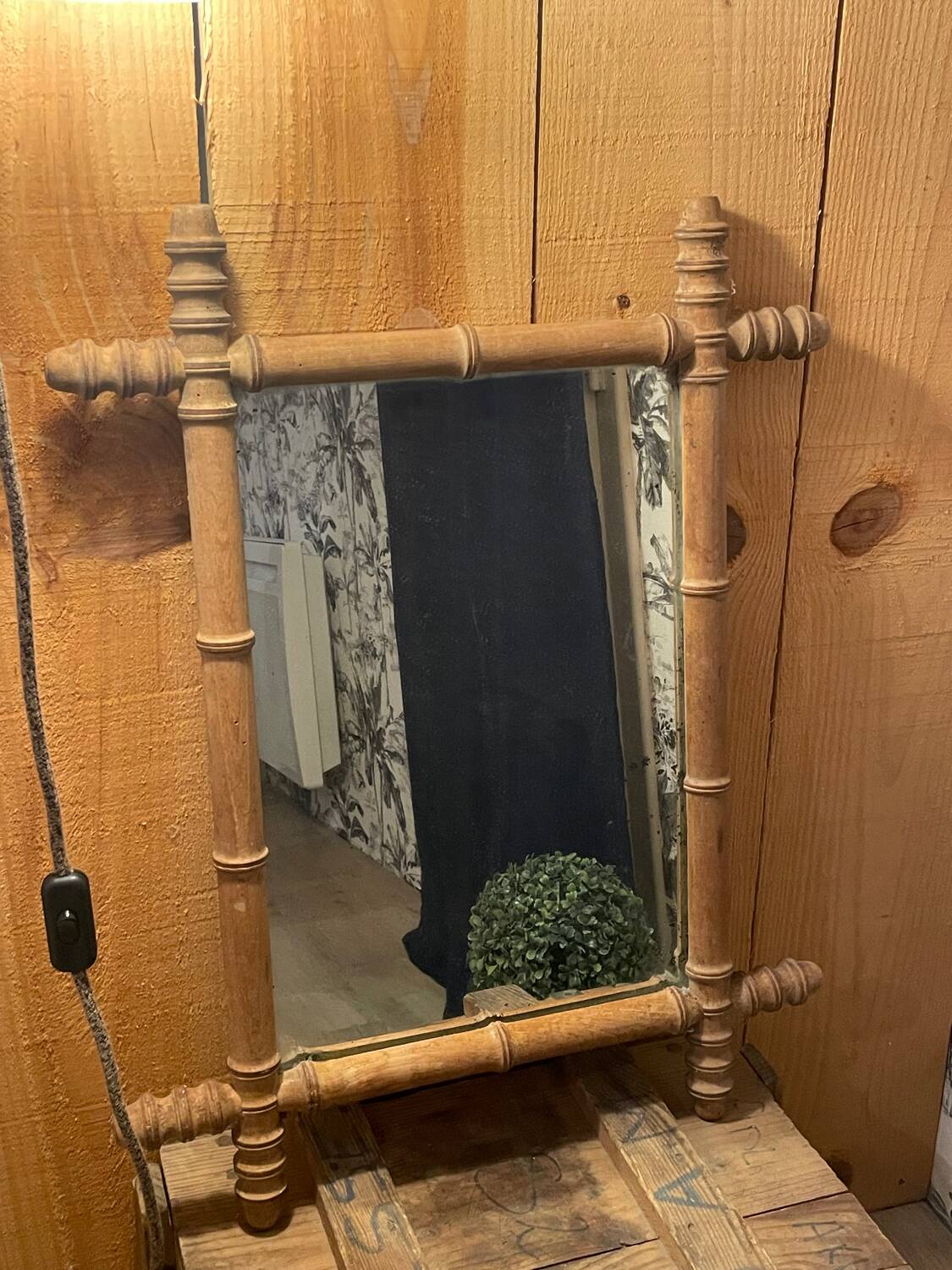 Carved wooden mirror in a bamboo style