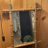 Carved wooden mirror in a bamboo style