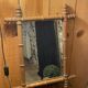 Carved wooden mirror in a bamboo style