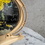 French mid-century school globe with black oceans on printed paper, cream plastic base
