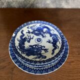 Asian porcelain plates decorated with blue dragons