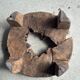 Small low circular four-legged stool in organic old teak with cut-out design H2