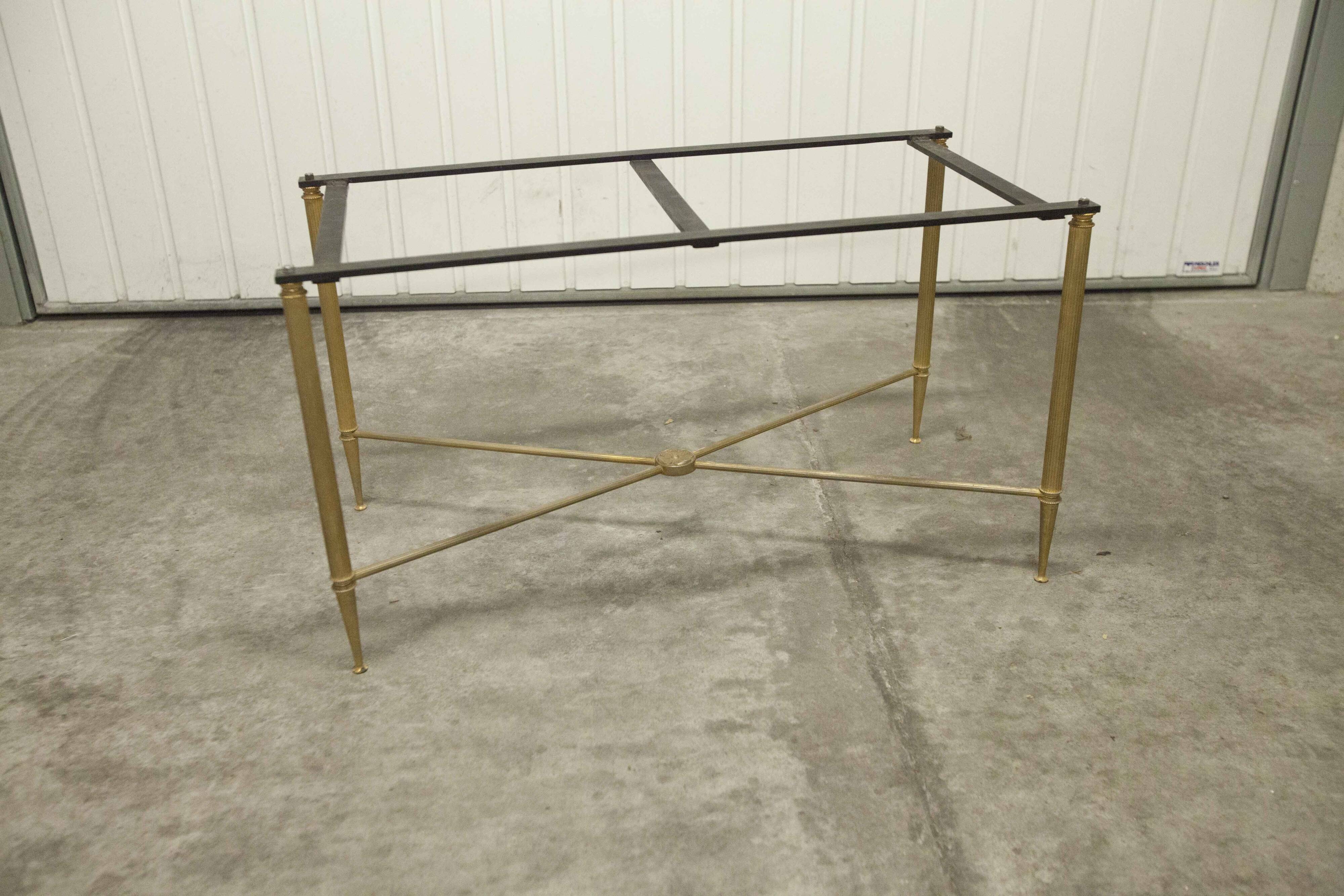 Marble coffee table with brass legs, height 46 cm.