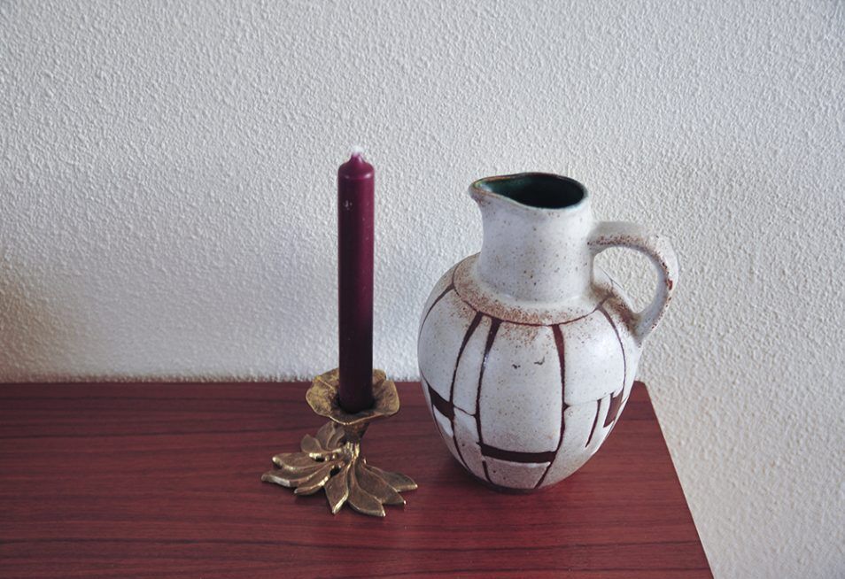 White vintage vase or pitcher with brown lines
