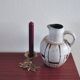 White vintage vase or pitcher with brown lines