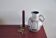 White vintage vase or pitcher with brown lines