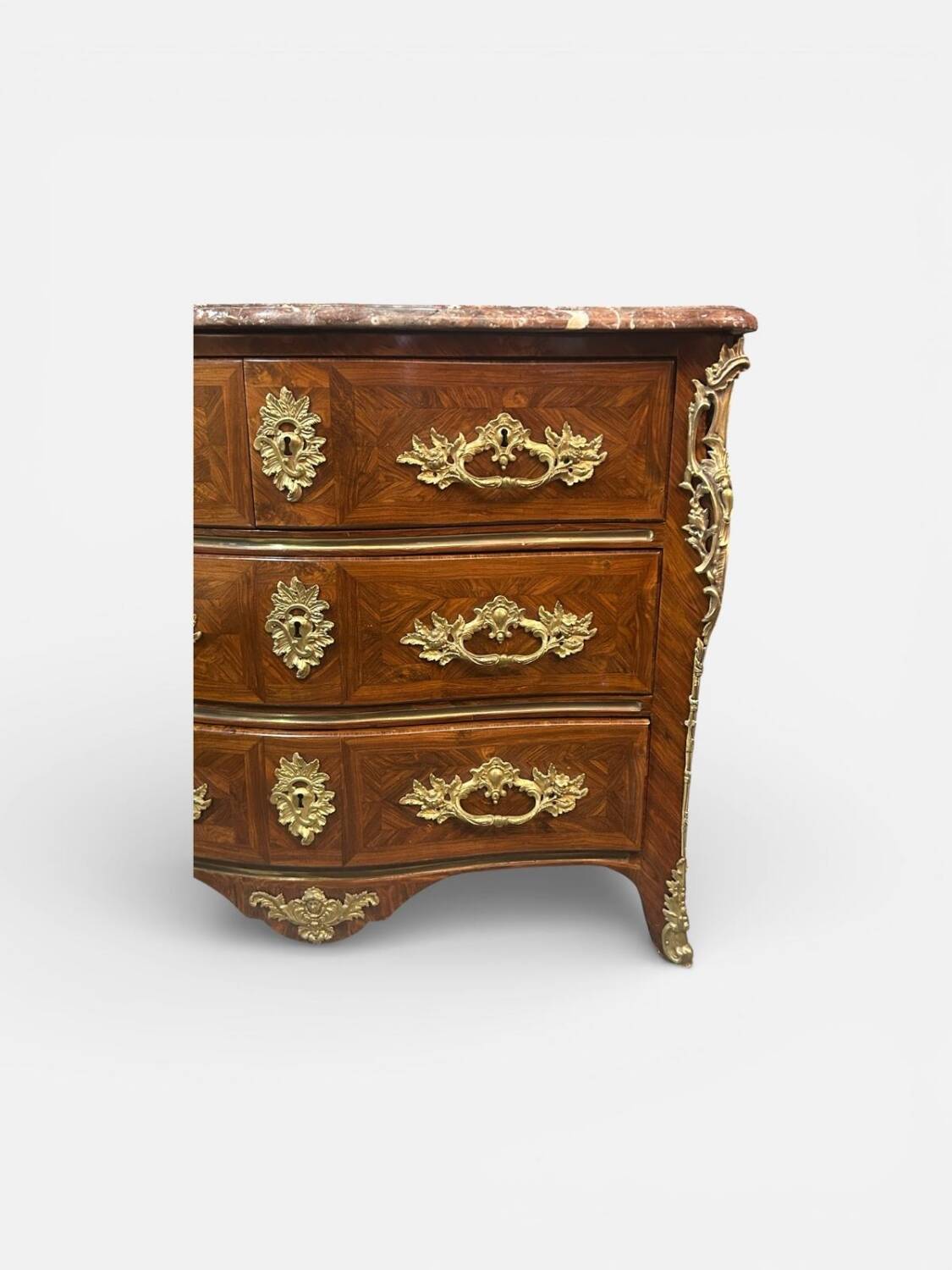 Louis XV period commode with violet wood veneer.