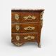 Louis XV period commode with violet wood veneer.