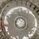 Large glass ashtray with frosted flowers.