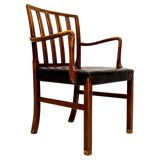 Mid-century armchair by Ole Wanscher for Fritz Hansen, stained beech and leather.