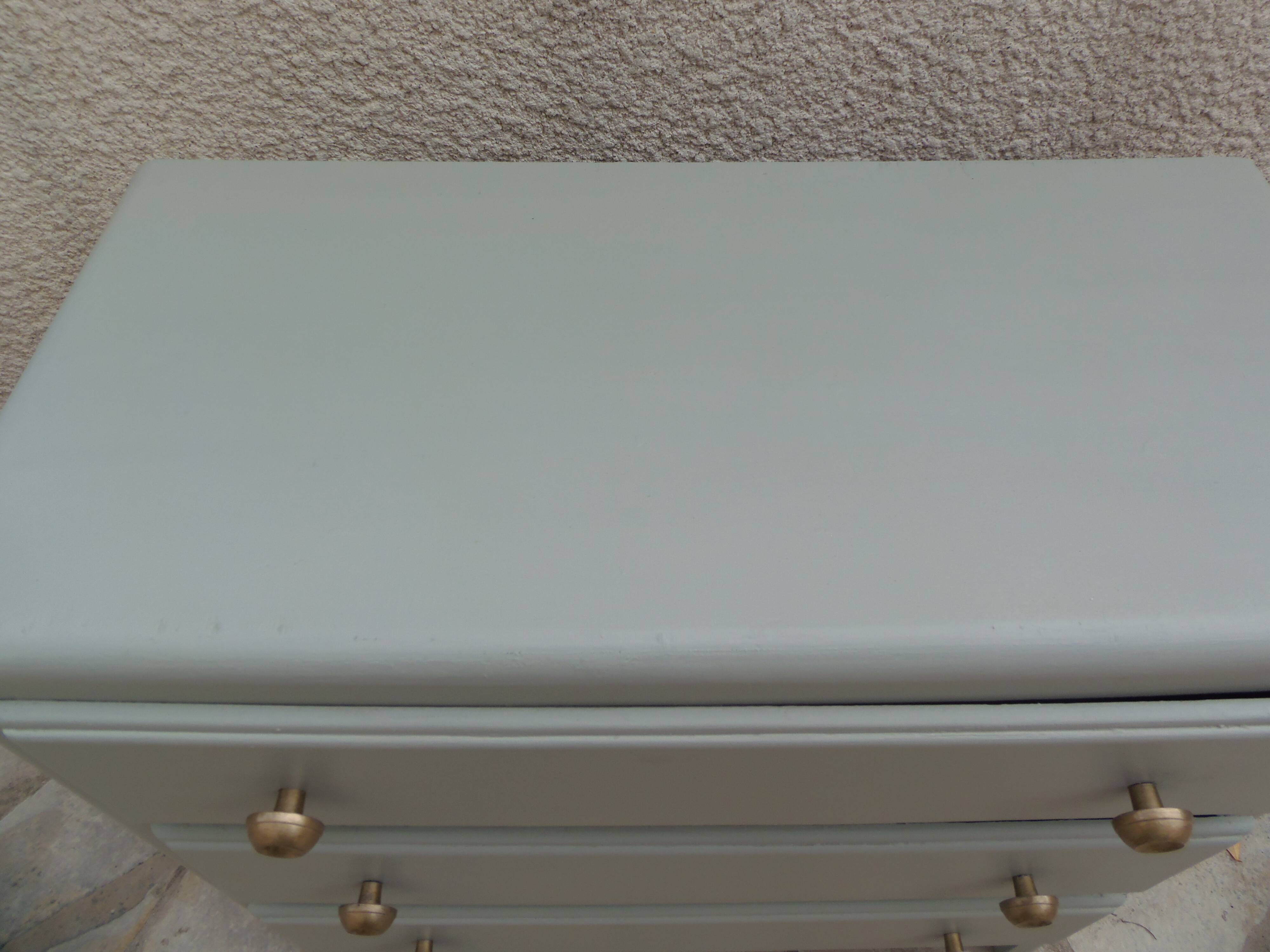 Vintage commode enhanced in grey-green.