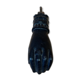 Old cast iron door knocker - woman's hand with ring