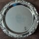 Silver-coloured metal plate