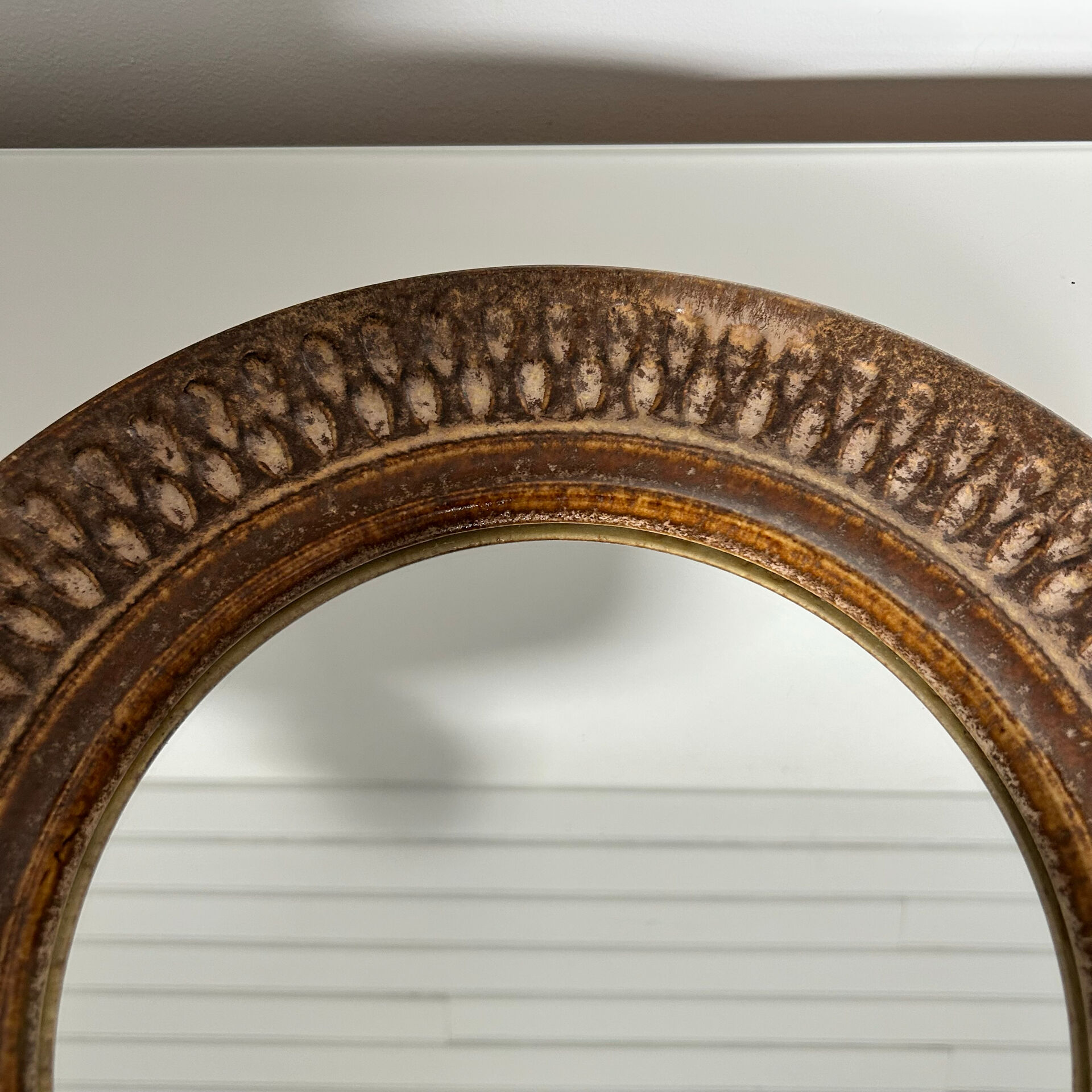 Chiselled stone mirror