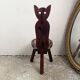 Folding tripod stool with cat back