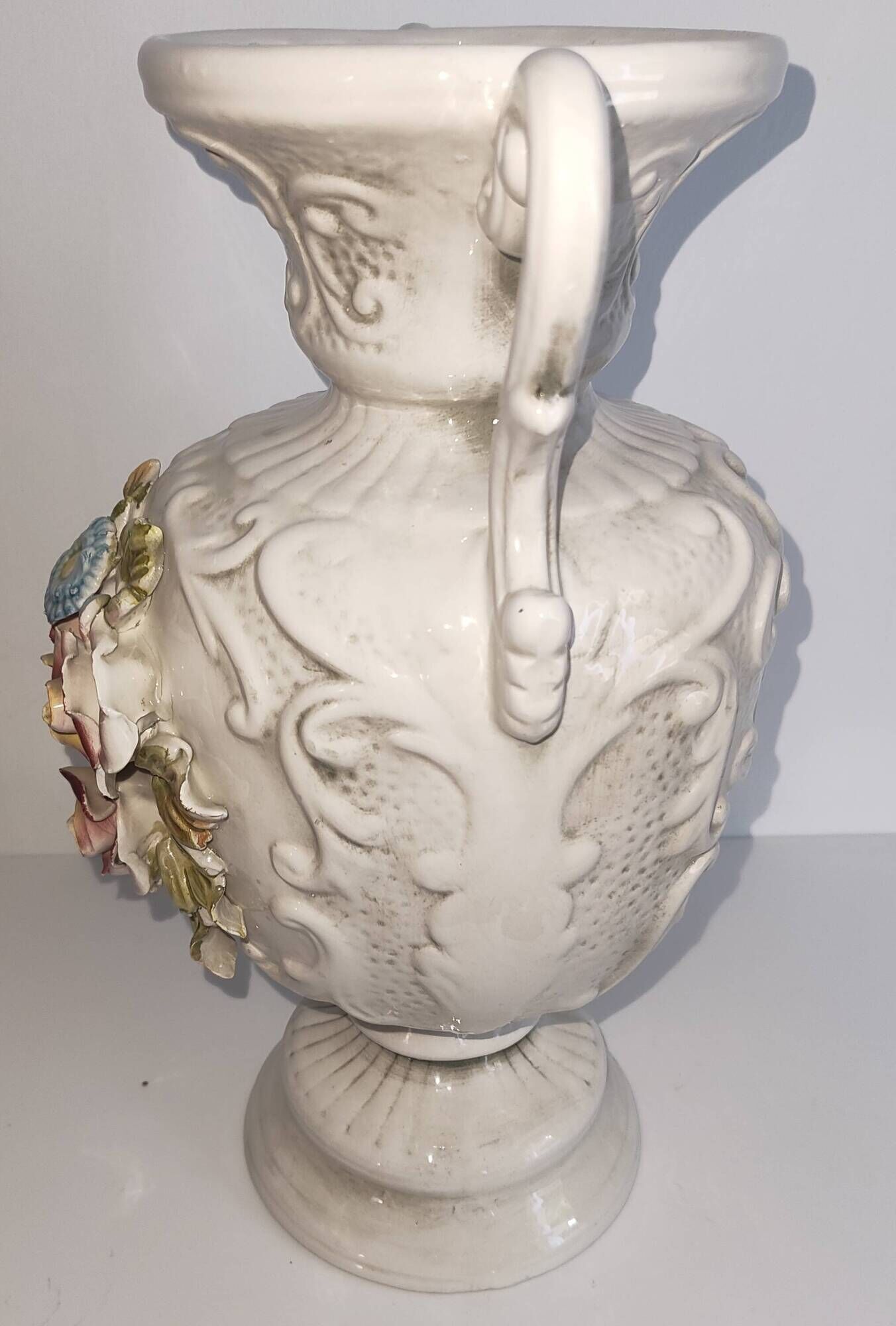 Vintage Italian white ceramic vase with raised floral decoration.