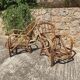 Paire de chauffeuses en rotin Audoux Minnet 1960