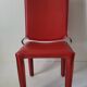 Red leather chairs by Arper
