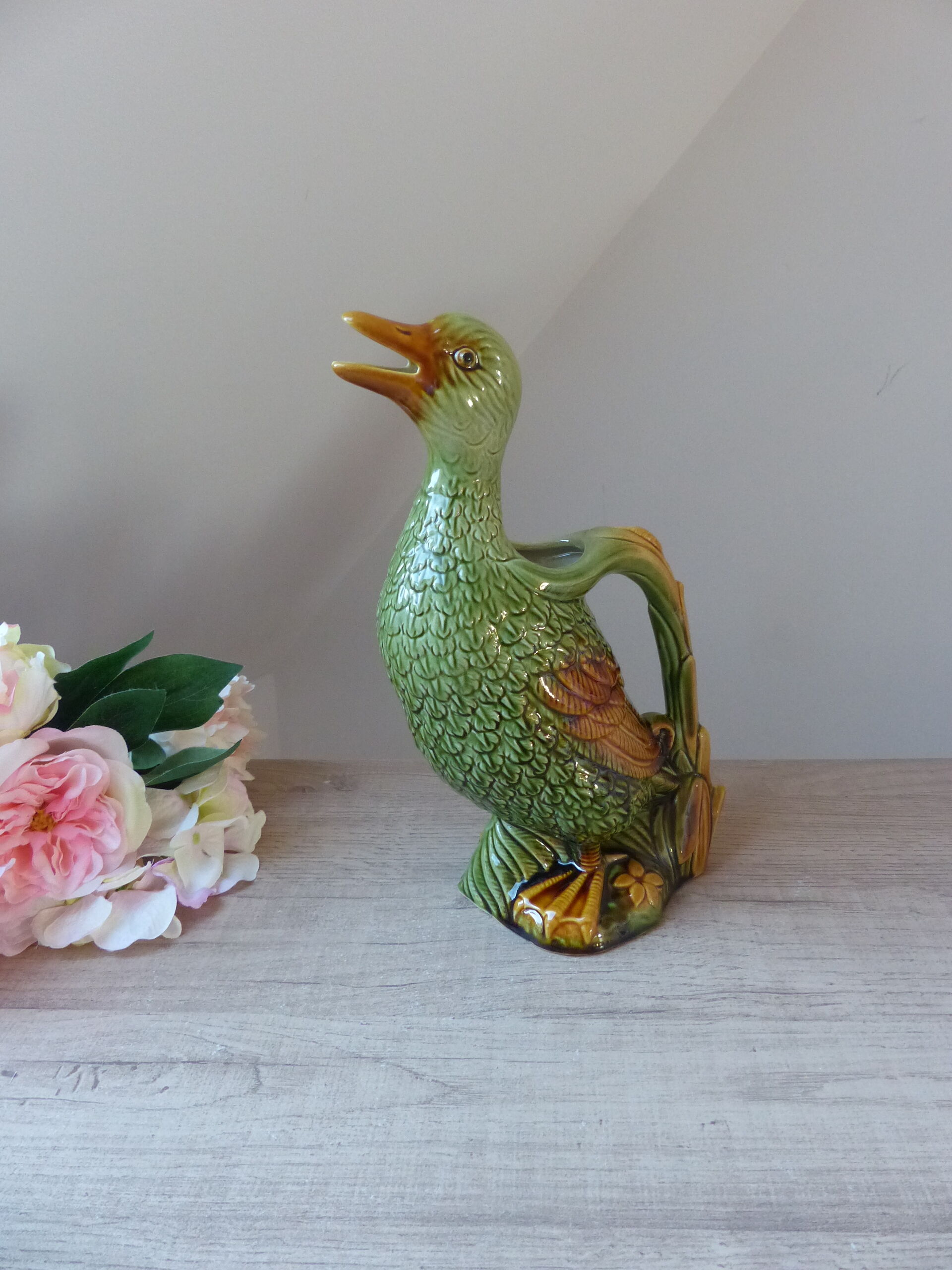 Pitcher zoomorph duck in green and yellow slip