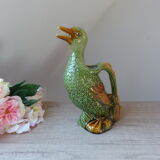 Pitcher zoomorph duck in green and yellow slip