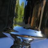 Candle holder in eglomerized glass