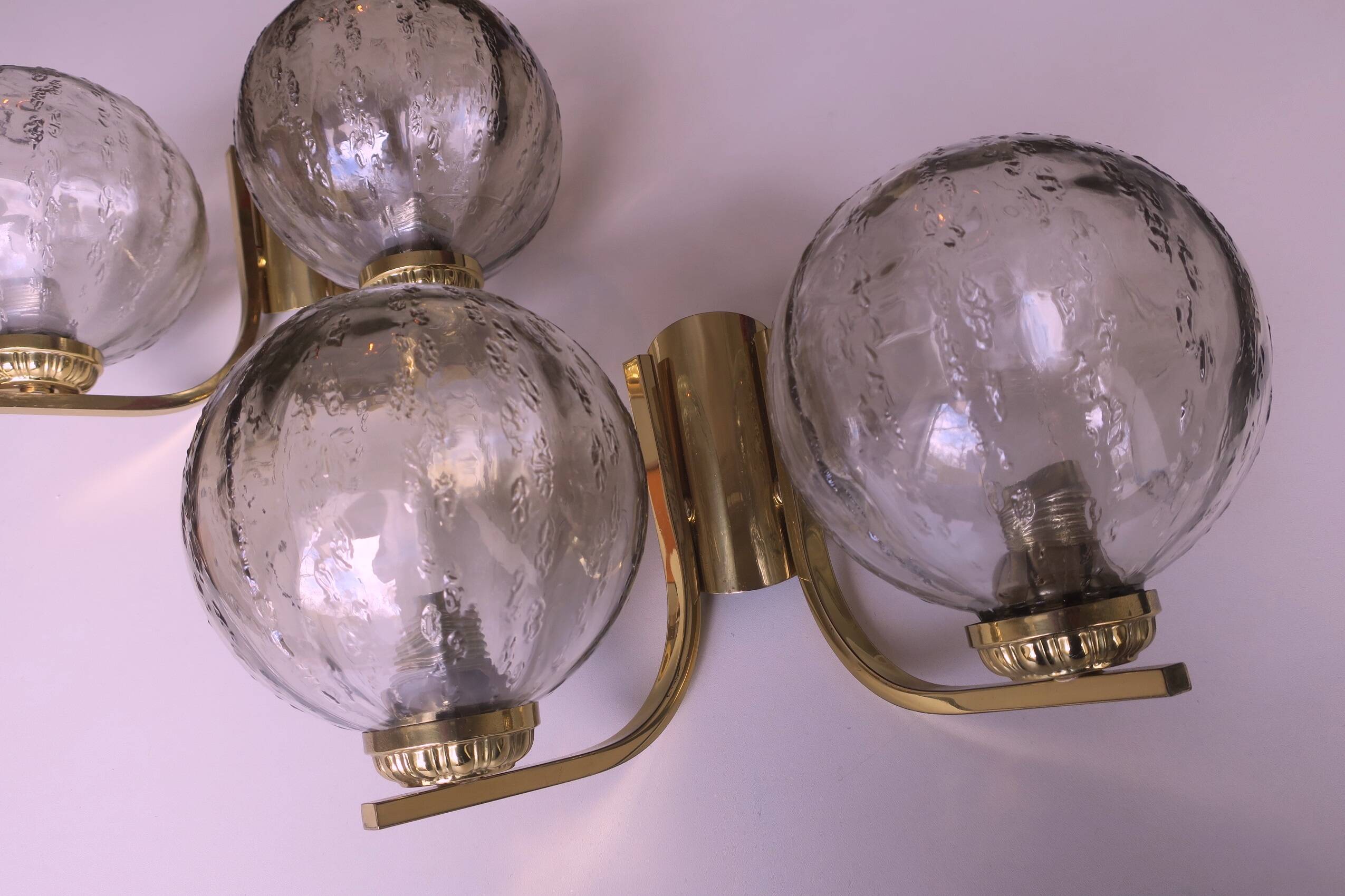 Mid century pair of brass and glass double wall lights, 1970s