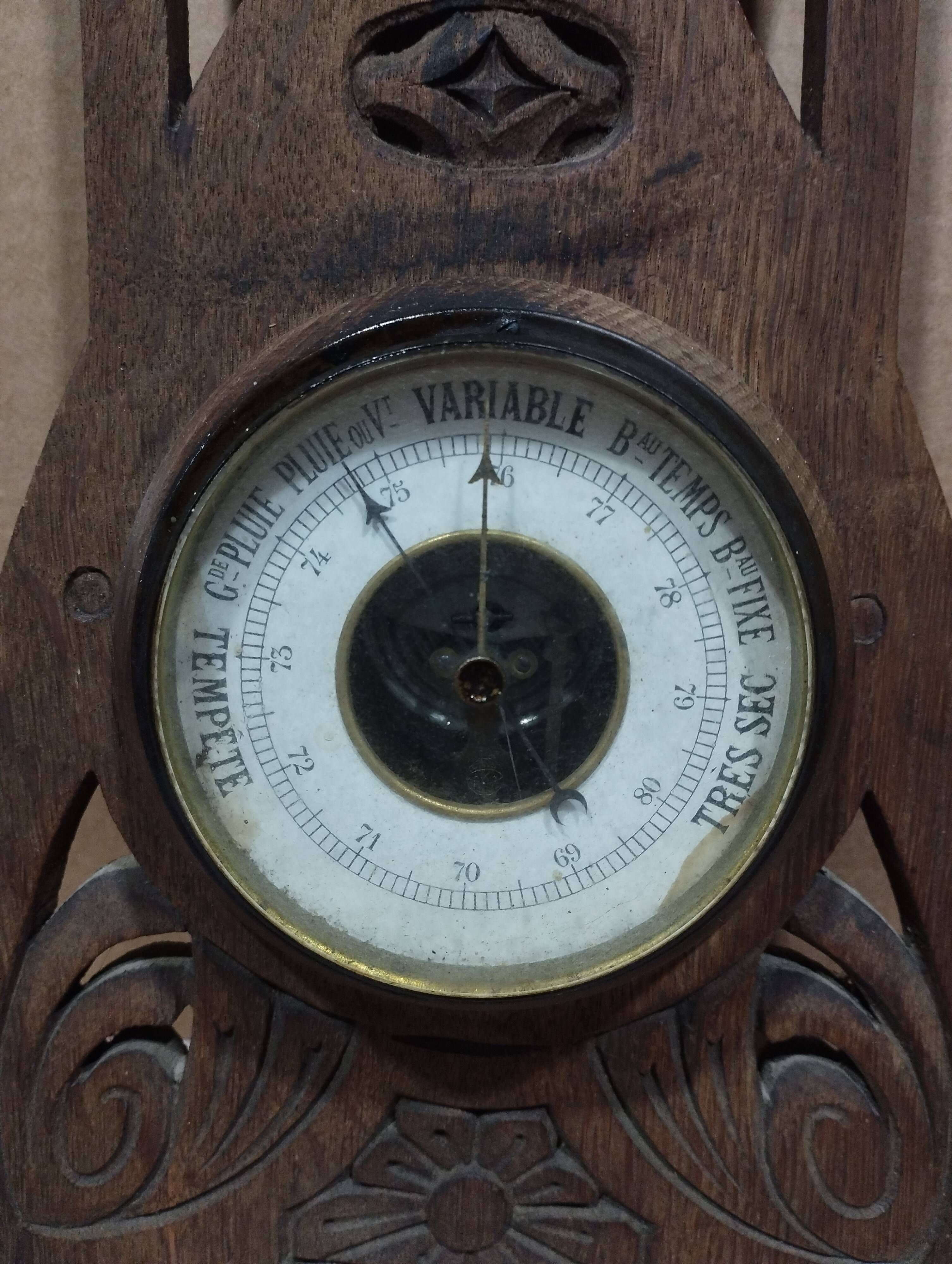 Old barometer and thermometer from the 1930s in carved wood. Signed on the back EH PARIS.