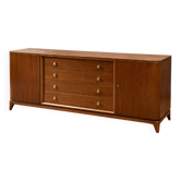 According to André Arbus, a sideboard in a row from the Art Deco period in blonde mahogany.