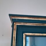 Glass cabinet in green patinated wood