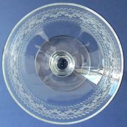 Suite of six champagne glasses on foot in engraved colorless crystal