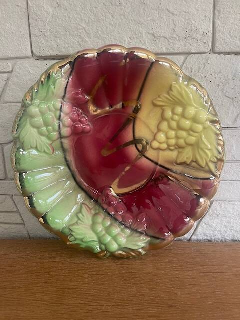Old fruit bowl in tricolor Barbotine. Grape decor.