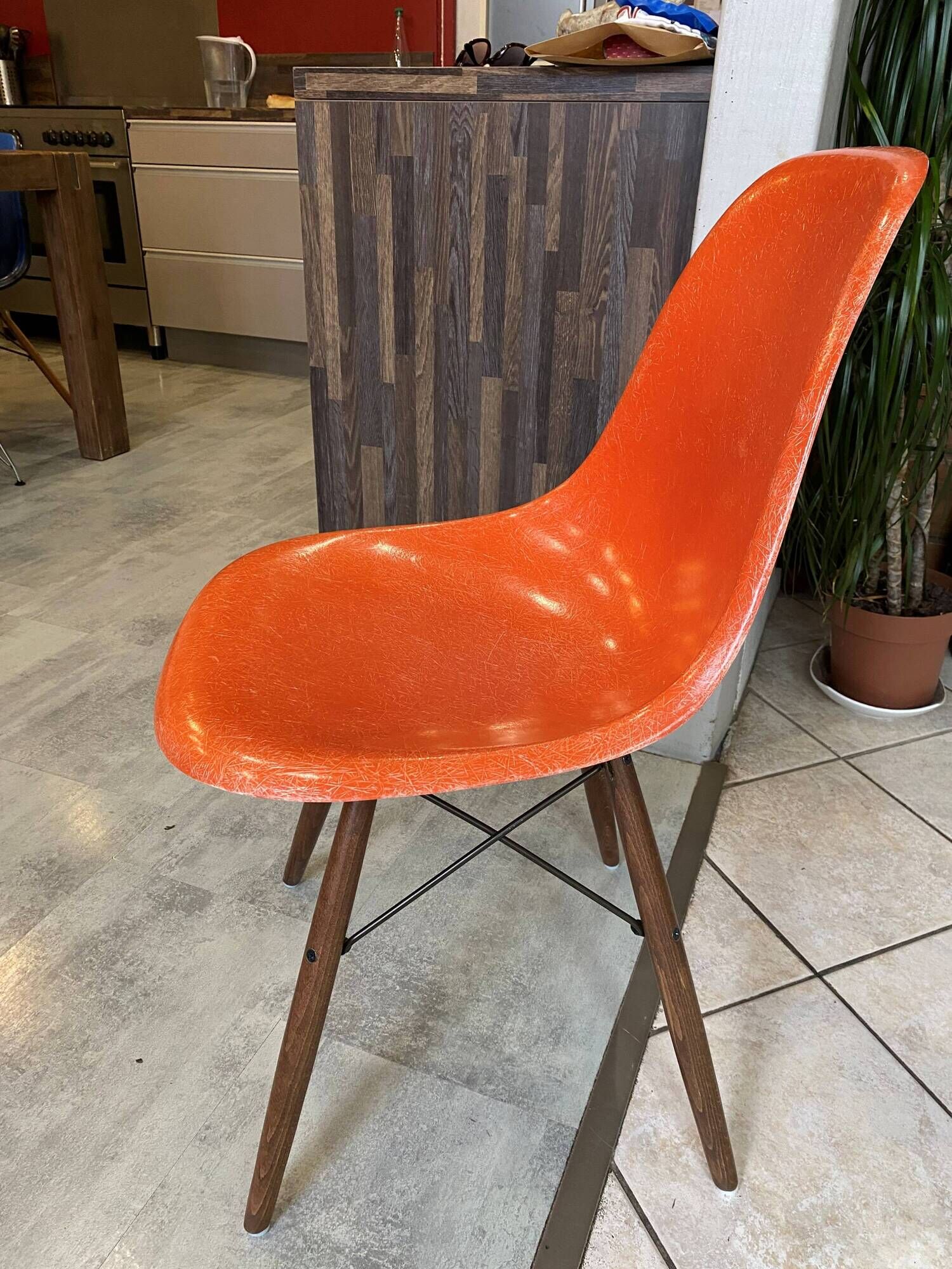 A vintage 70s Eames Herman Miller DSW Fiber Red Orange Dowel Walnut Chair