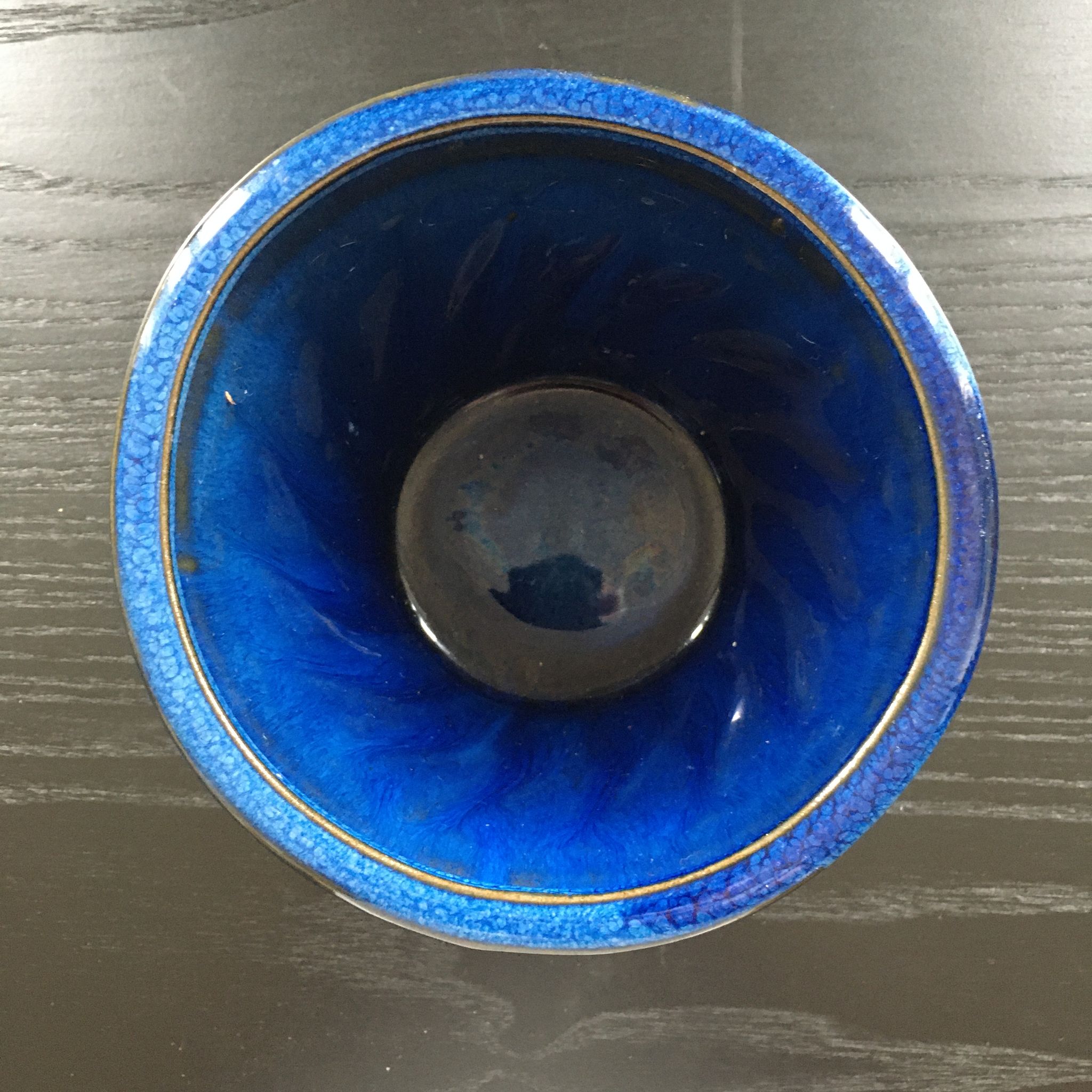 Navy blue stoneware pot.