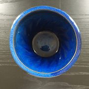 Navy blue stoneware pot.