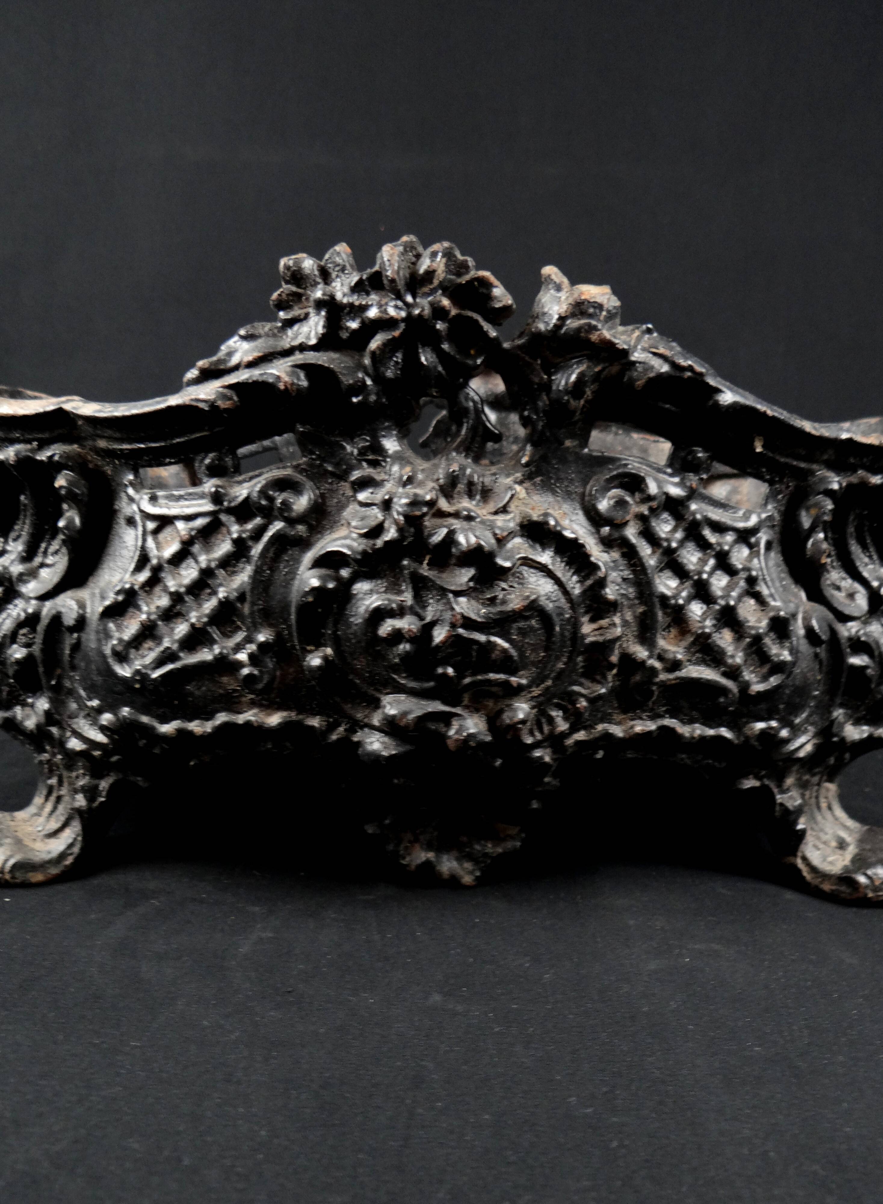 Antique black cast iron planter from the late 19th century Rocaille style