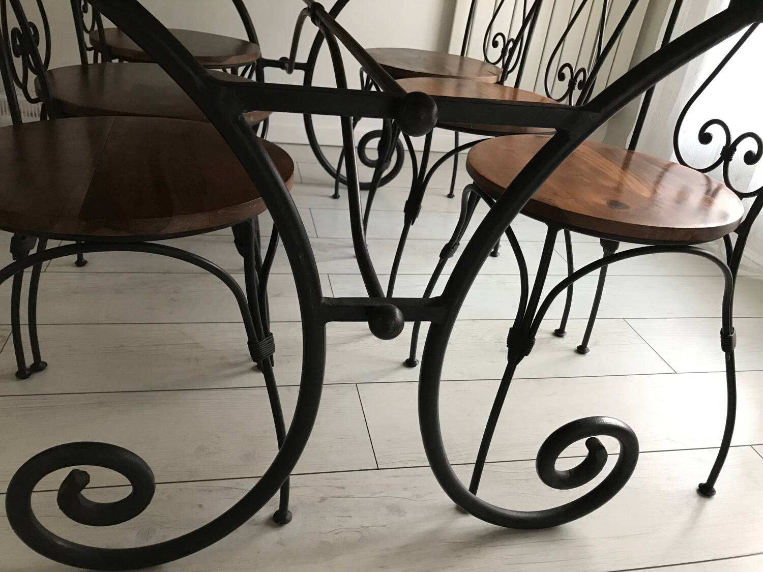 Wrought iron table with wooden top and 6 chairs