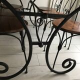 Wrought iron table with wooden top and 6 chairs