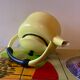 Old kettle in yellow enamelled sheet metal and Bakelite