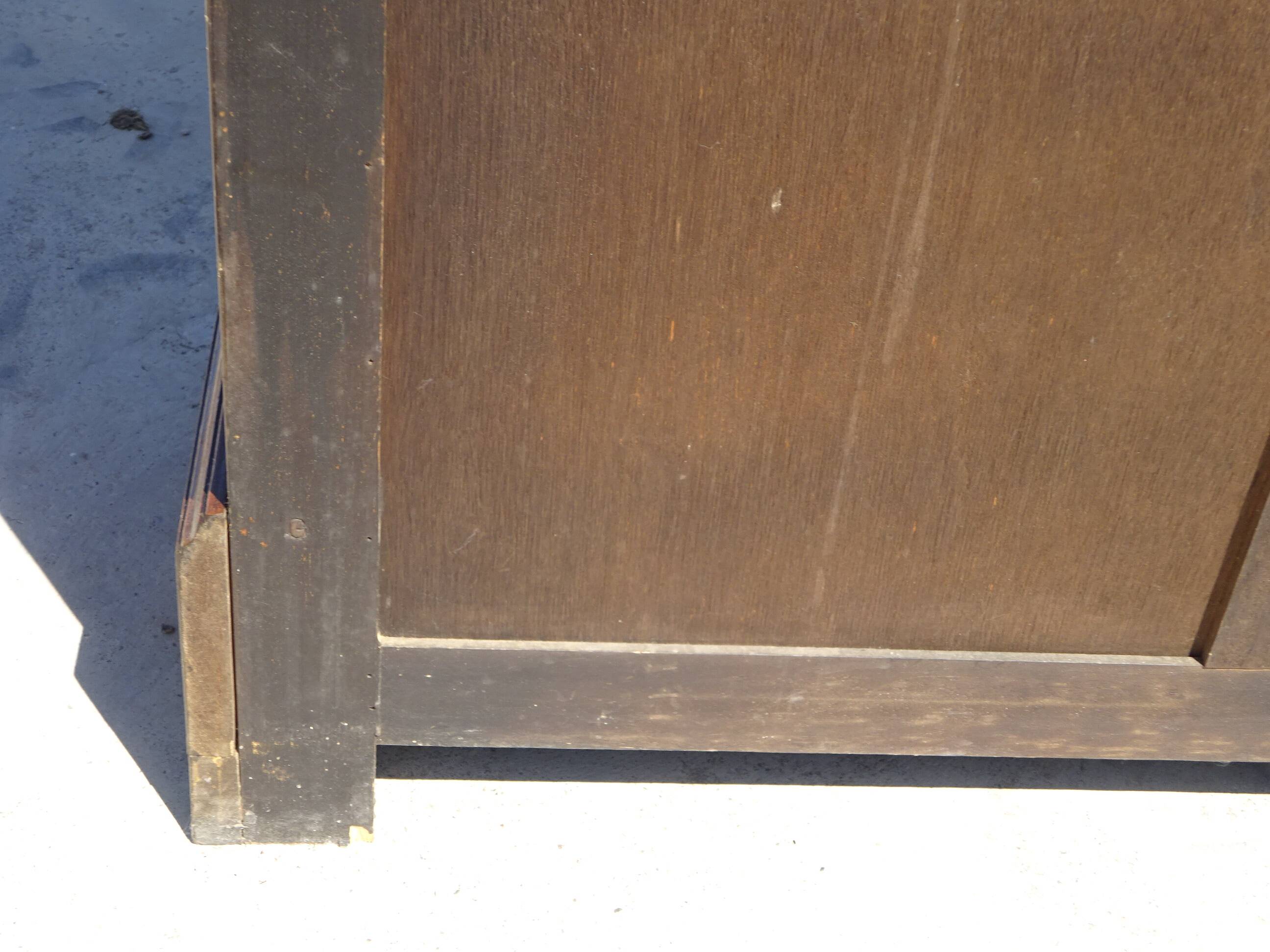 Chest of drawers with decorated handles in the Louis XVI style.