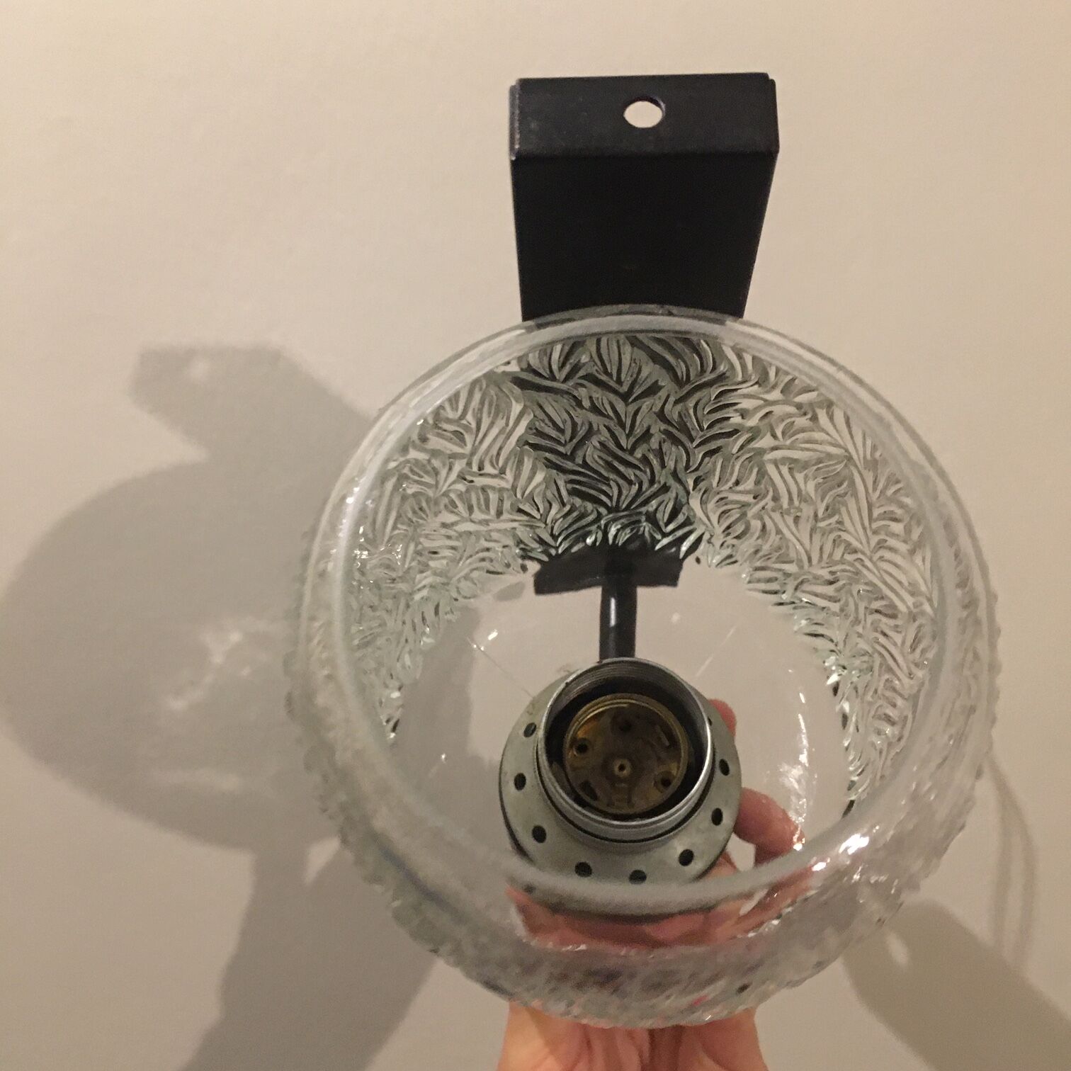 Black metal and molded glass wall sconce