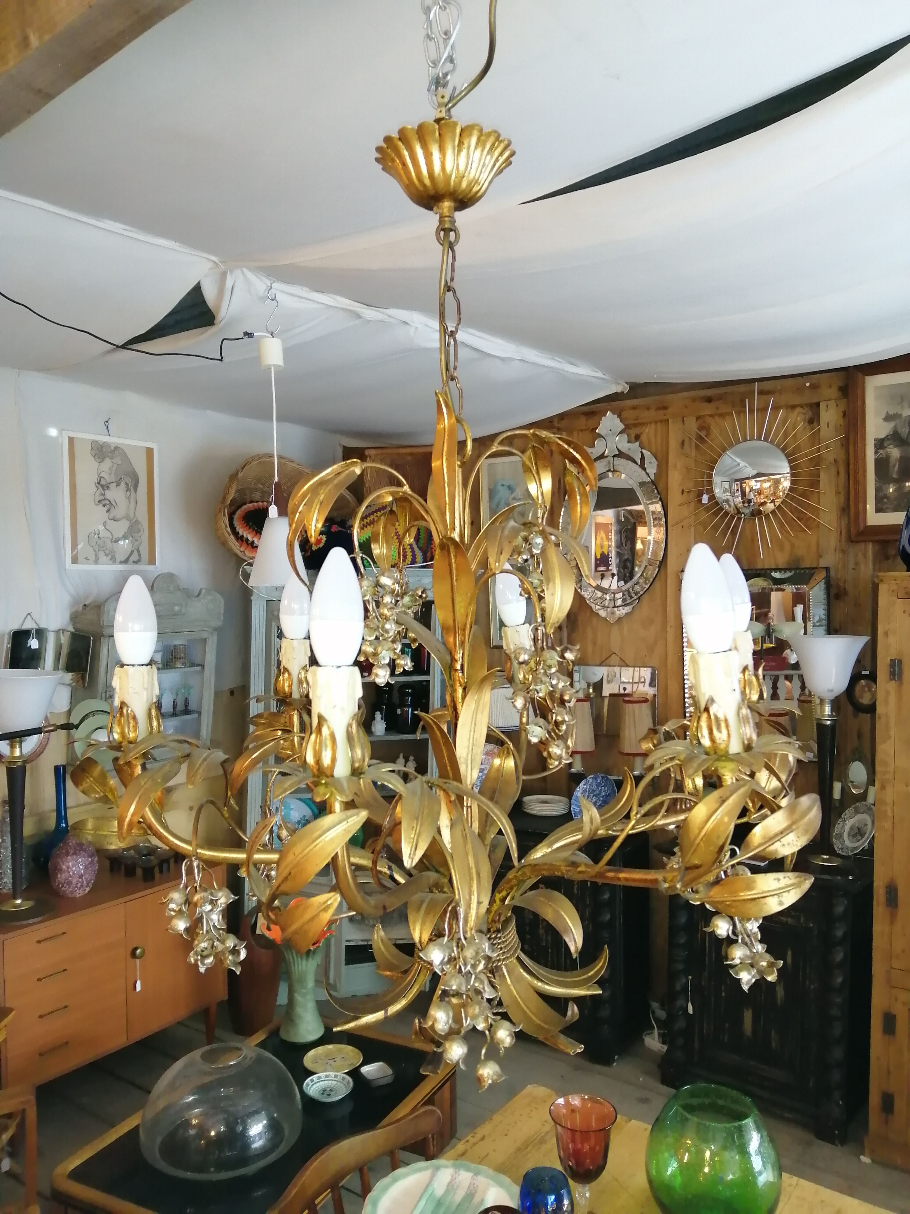 Gilded brass chandelier and silver lily of the valley bells