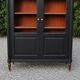 Renovated black antique Louis XVI style display cabinet, glass-fronted bookcase.