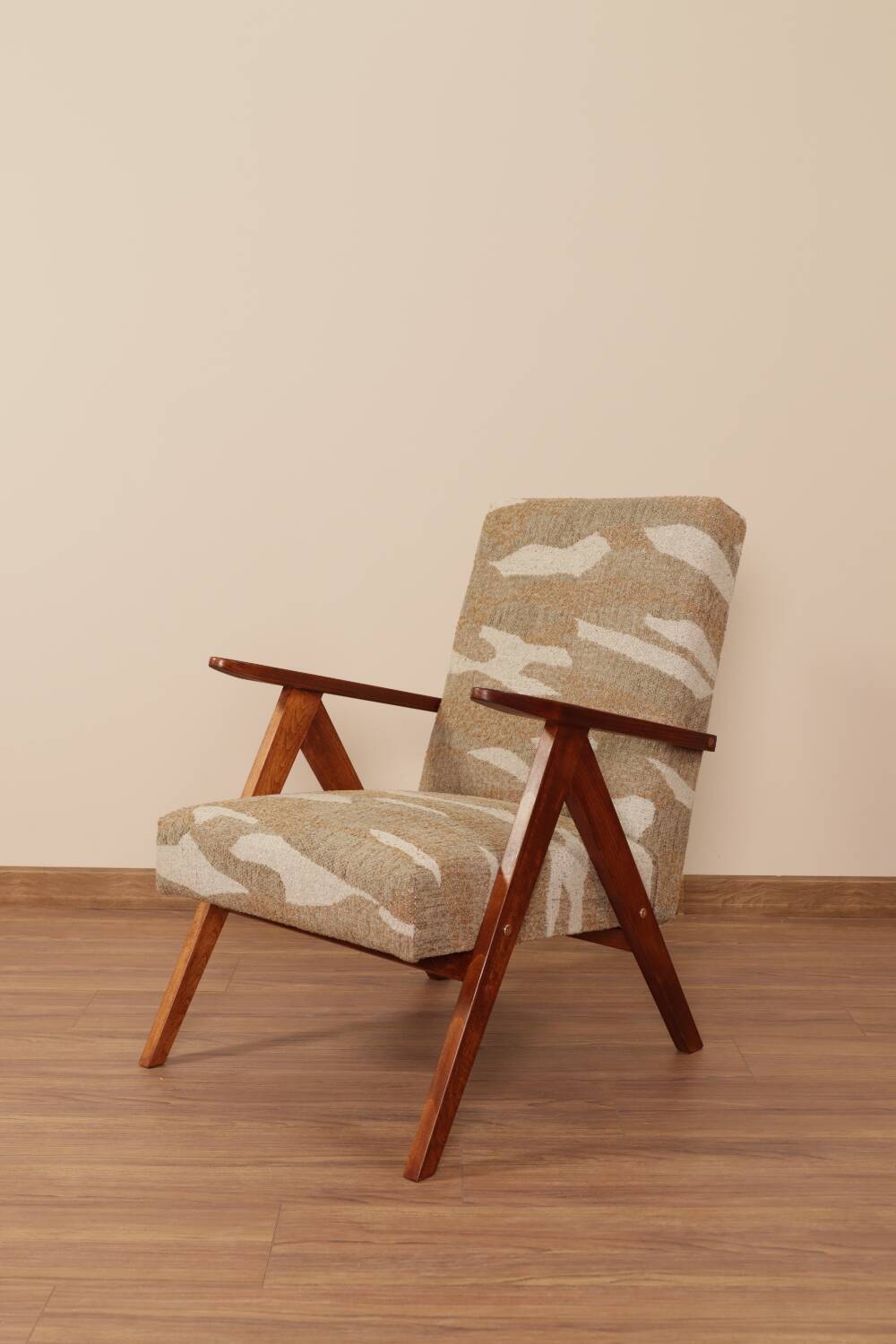 Pair of vintage lounge chairs in brown jacquard fabric and wood.